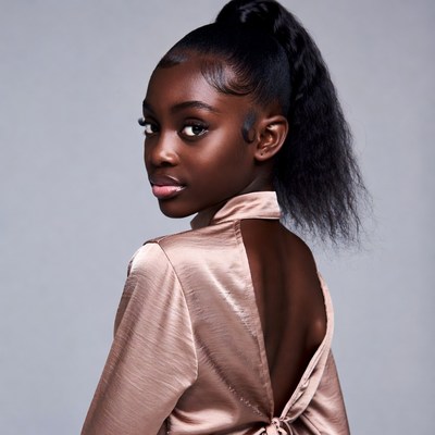 African girl in backless satin dress