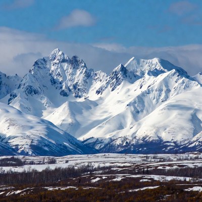 Snowy Mountain Peaks Under Blue Sky