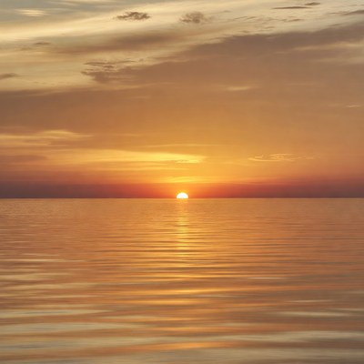 Sunset over calm ocean water