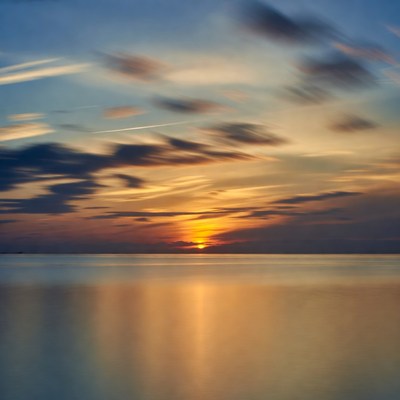 Sunset over calm ocean water