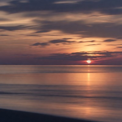 Sunset over calm ocean