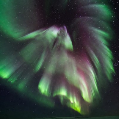 Vibrant swirling Northern Lights aurora