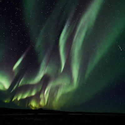 Vibrant Northern Lights over Landscape