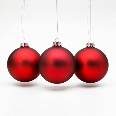 Three Red Christmas Ornaments Hanging