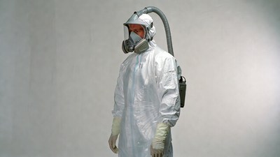 Man in hazmat suit with respirator