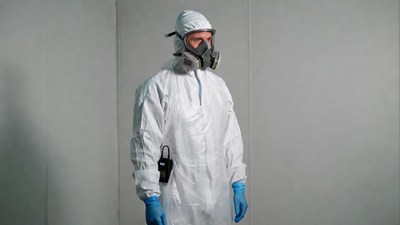Man in hazmat suit with respirator
