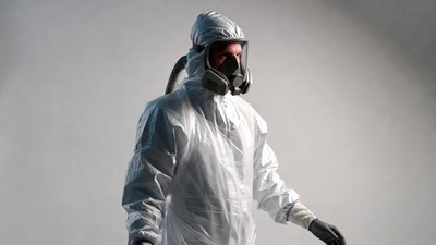 Man in hazmat suit with respirator