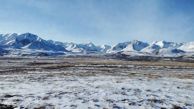 Snowy Mountains and Vast Plain