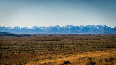 Snow-capped Mountains over Golden Plains