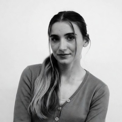 Woman in cardigan with ponytail