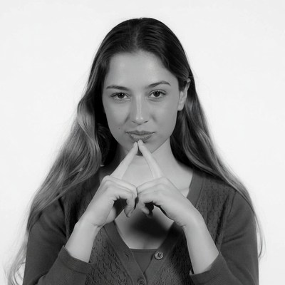 Woman making shh gesture