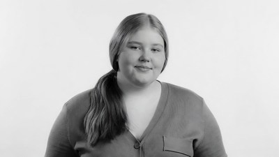 Smiling young woman in cardigan