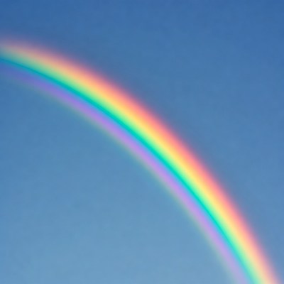 Vibrant Rainbow in Blue Sky