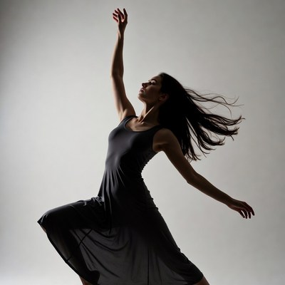 Woman dancing in silhouette pose