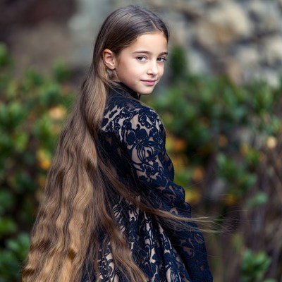 Girl with long hair in lace dress