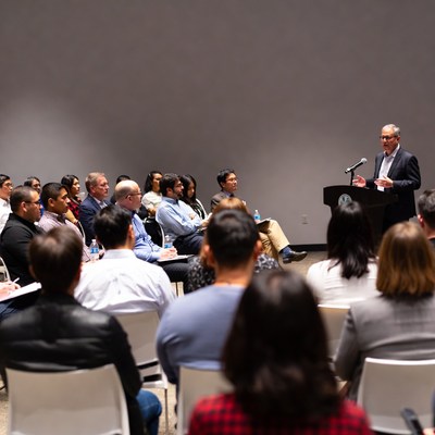 Man speaking at conference audience