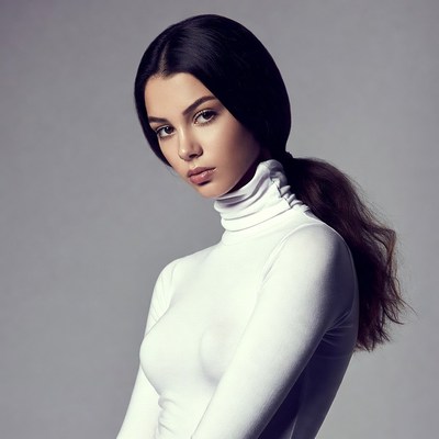Woman in white turtleneck ponytail