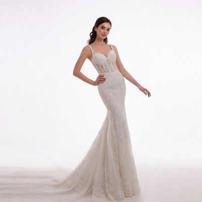 Woman in white lace mermaid gown