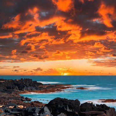 Dramatic Sunset Over Volcanic Coast