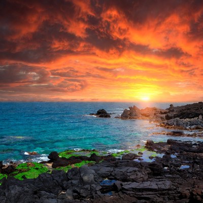 Dramatic Sunset Over Rocky Ocean Coast