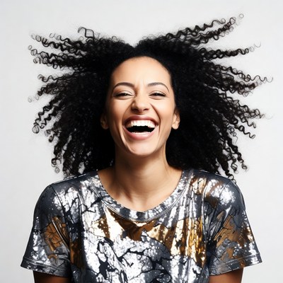 African-American woman laughing with curly hair