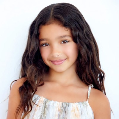Smiling mixed-race girl with wavy hair