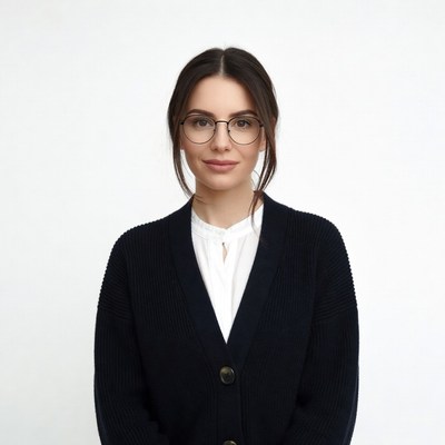 Woman in black cardigan and glasses