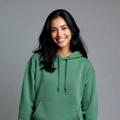 Smiling Latina woman in green hoodie
