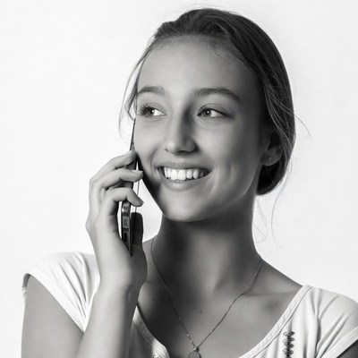 Smiling girl talking on phone