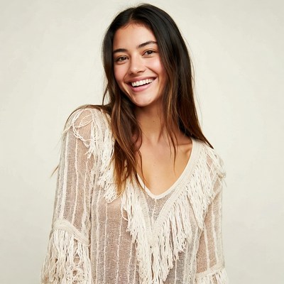 Smiling woman in fringed lace top
