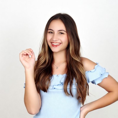 Smiling young woman in blue off-shoulder top