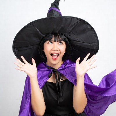 Asian girl in witch costume
