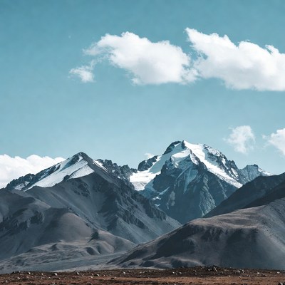 Snowy Mountains Under Blue Sky