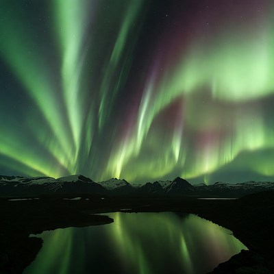 Northern Lights over Mountains and Lake