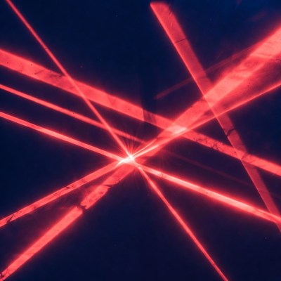 Red Laser Beams on Dark Background