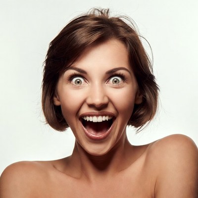 Surprised woman with wide eyes and open mouth