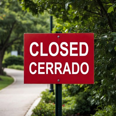Closed Cerrado Sign in Park