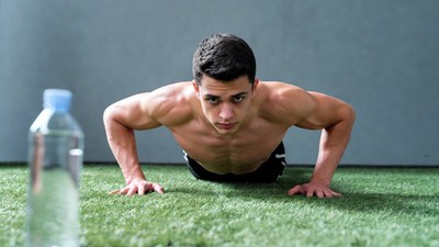 Muscular man doing pushups