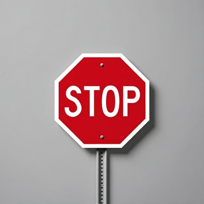 Red Stop Sign on Gray Background