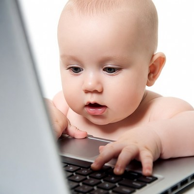 Baby using laptop computer