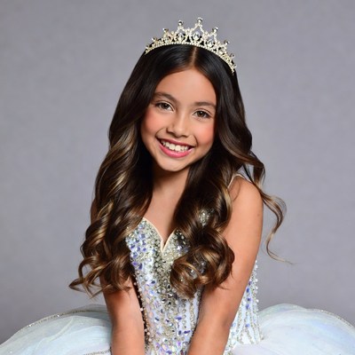 Girl wearing sparkling tiara and gown