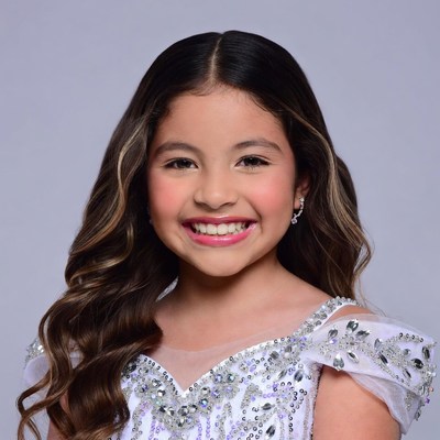 Smiling girl in sparkly white dress