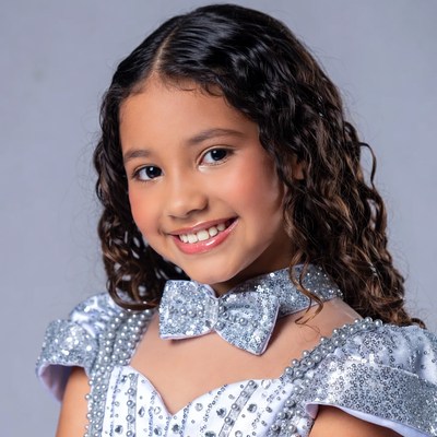 Young girl in sparkling silver dress