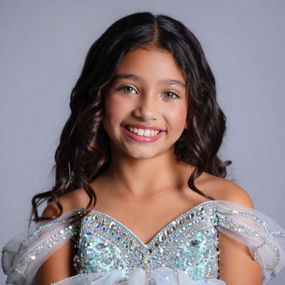 Smiling girl in sparkly blue dress