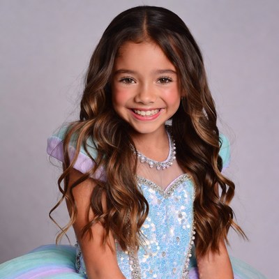 Girl in sparkly tutu dress smiling