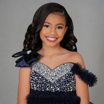 Young Black girl in sparkling navy dress