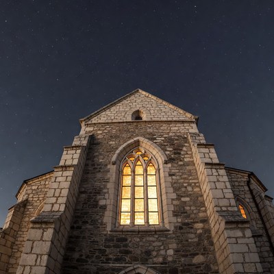 Gothic Church with Lit Stained Glass Window