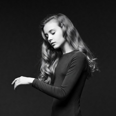 Young woman with wavy hair posing