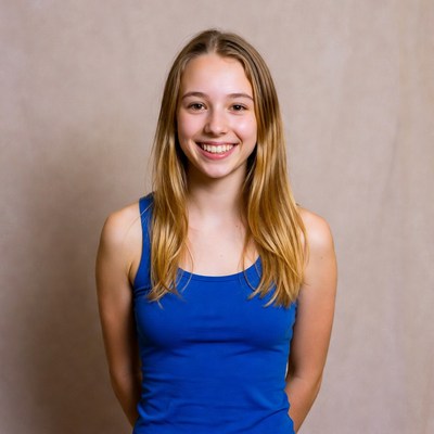 Teen girl smiling in blue tank top
