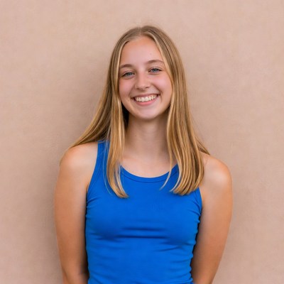 Smiling blonde teenage girl in blue tank top